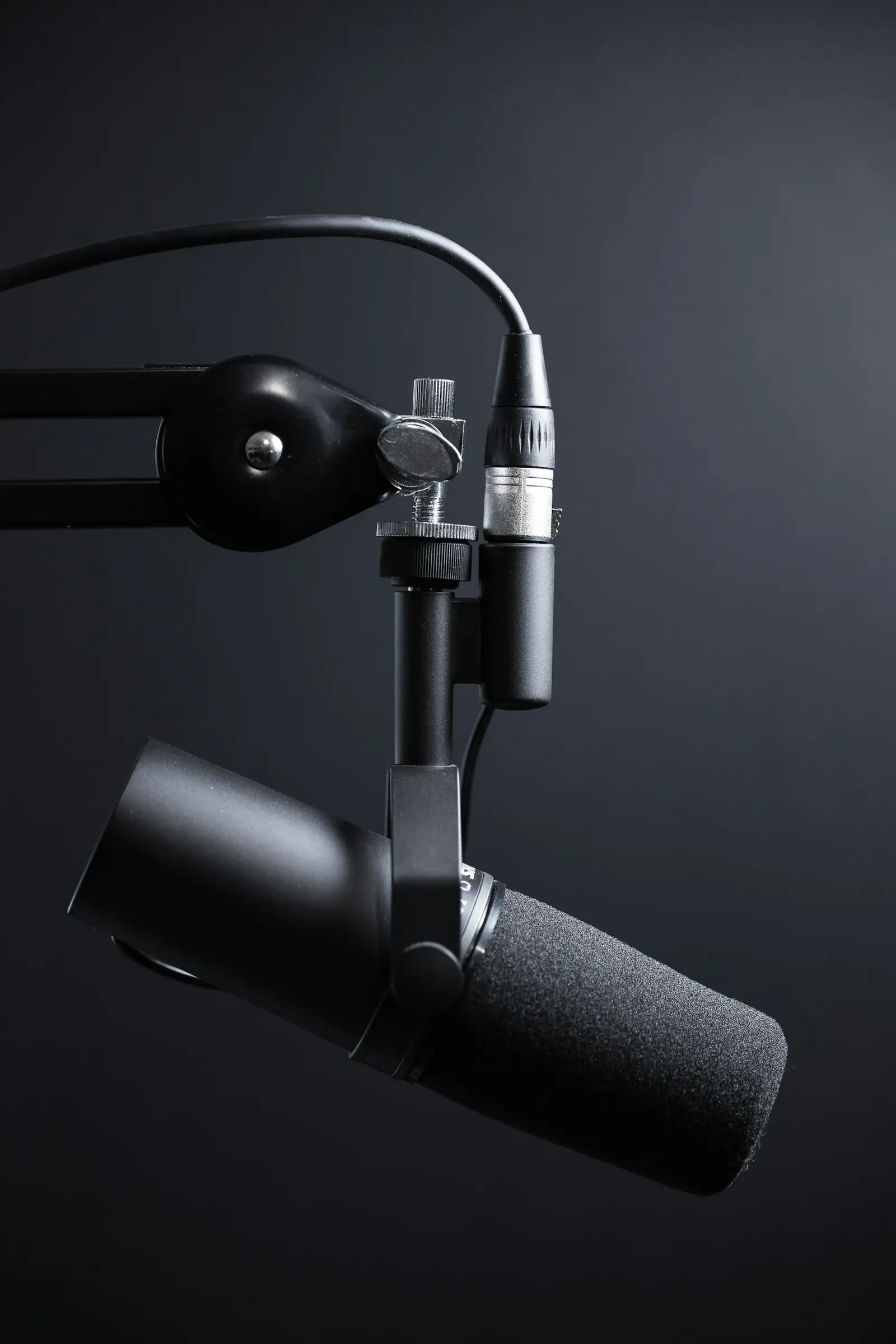 Broadcast microphone on a boom arm ready for a live stream
